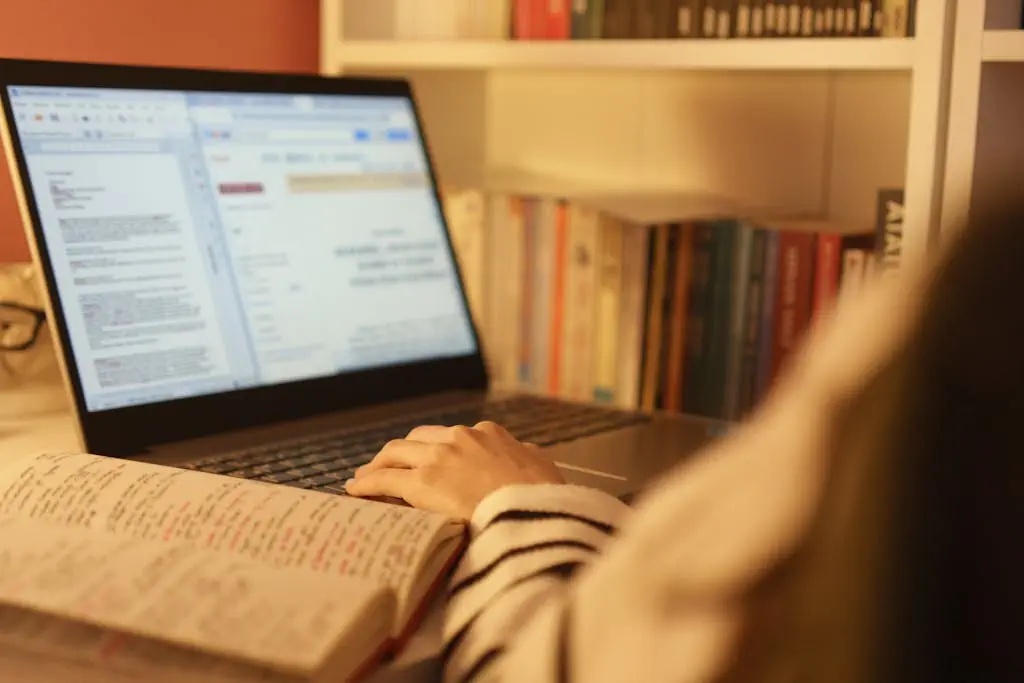 a person typing on a laptop